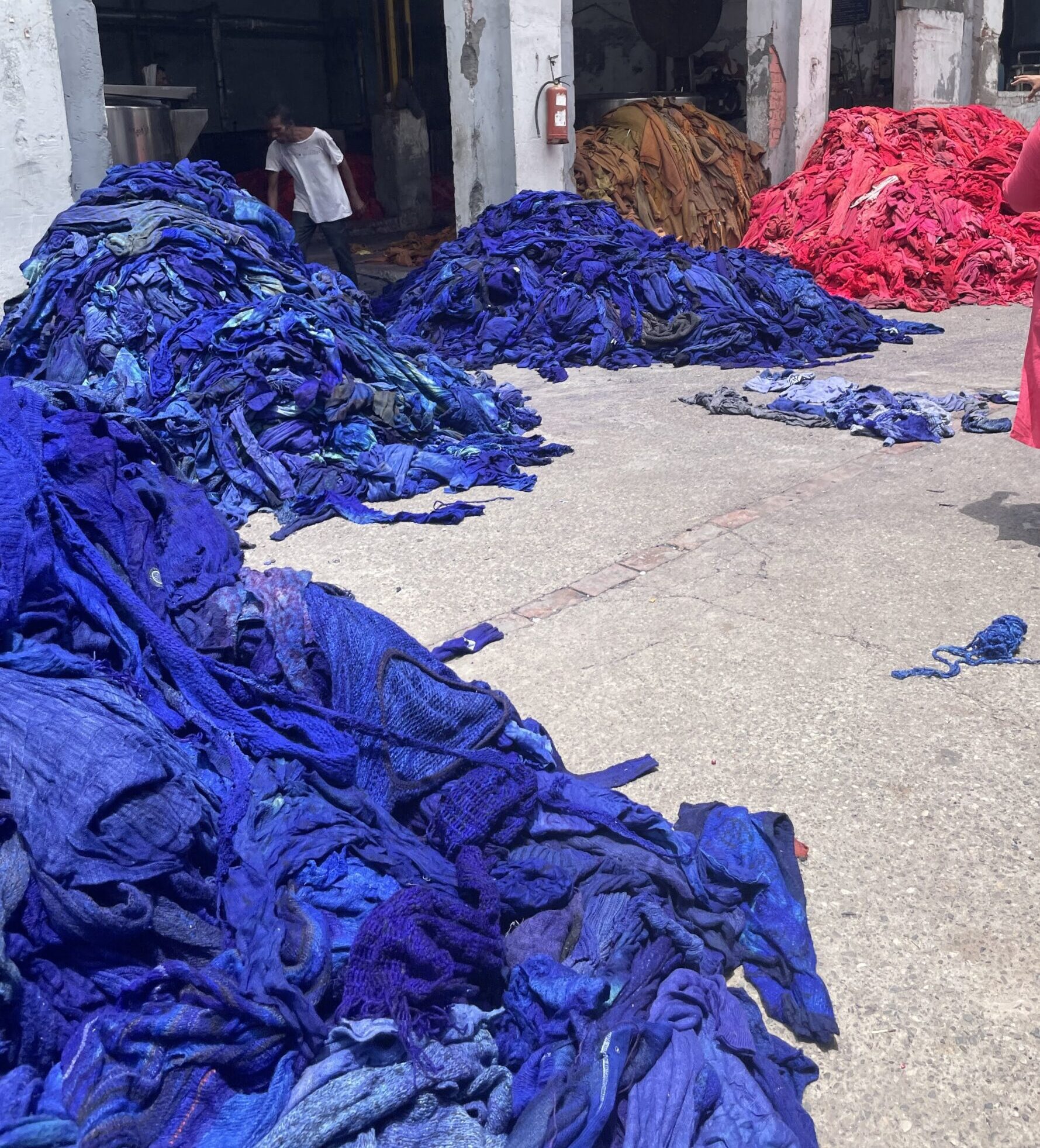 Piles of blue and pink fabric- india